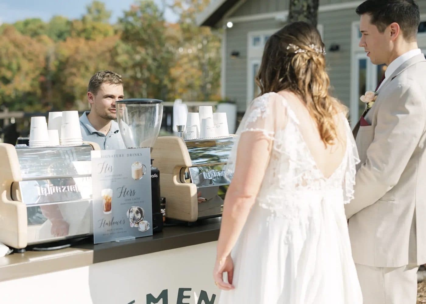Bride and groom visiting the Clement Coffee wedding coffee cart