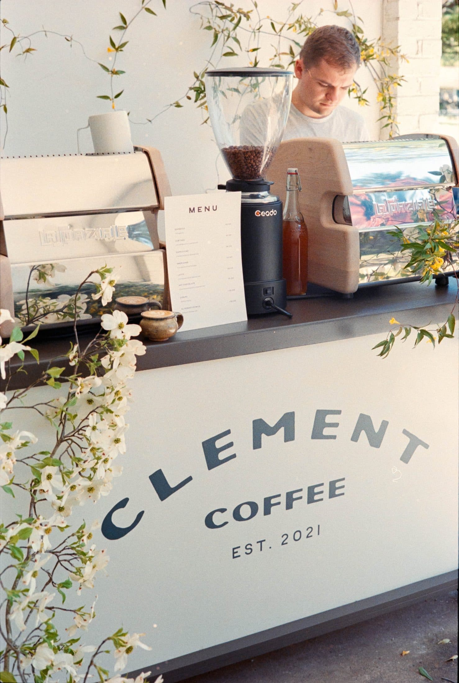 Clement Coffee barista working the espresso cart at an event