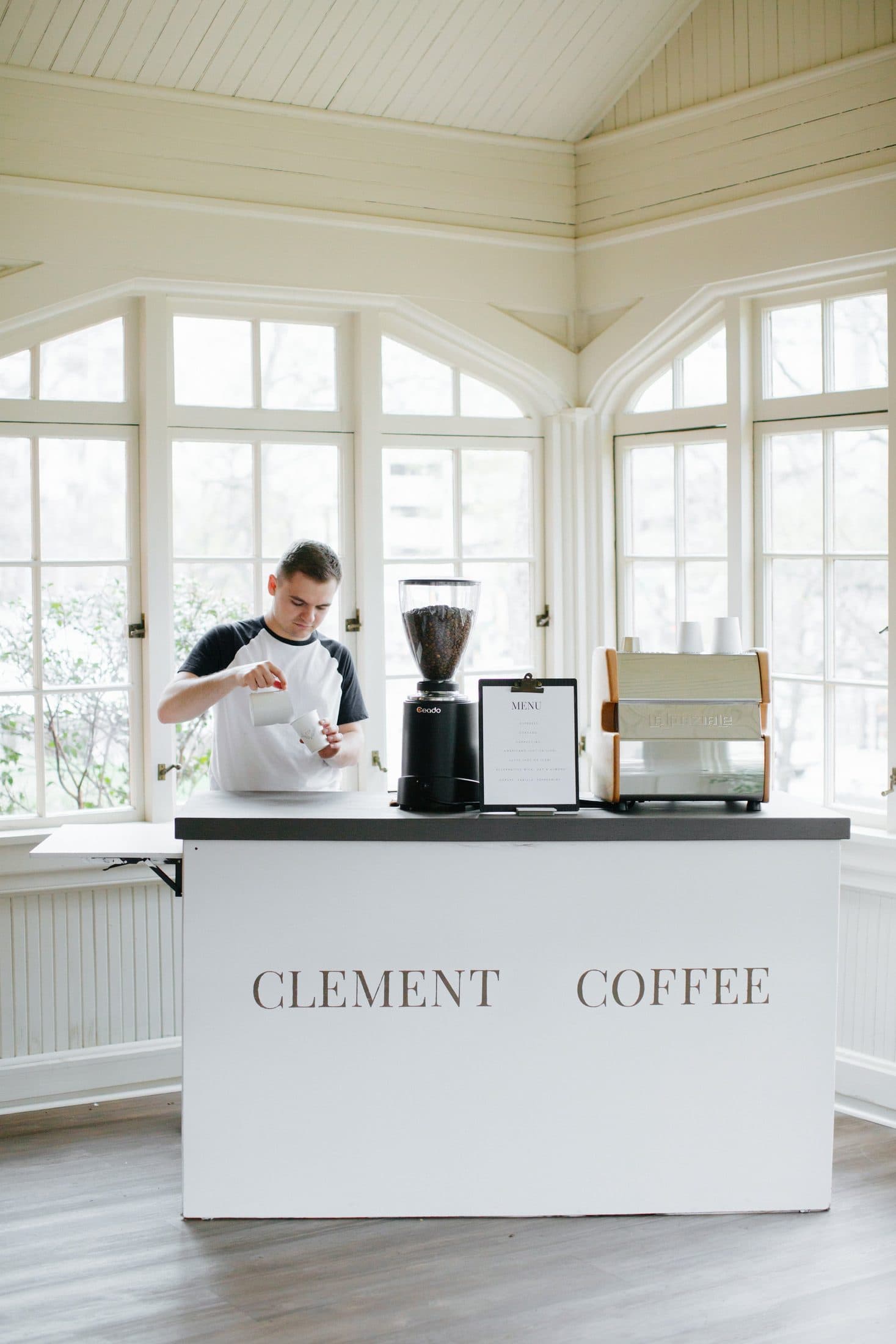 Clement Coffee cart with barista set up in a bright corporate event space